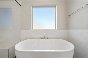 9314 Brunel Ln, Houston, TX 77044 - full bath with a freestanding bath