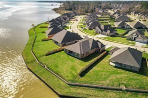 9314 Brunel Ln, Houston, TX 77044 - aerial view of residential area featuring a large body of water