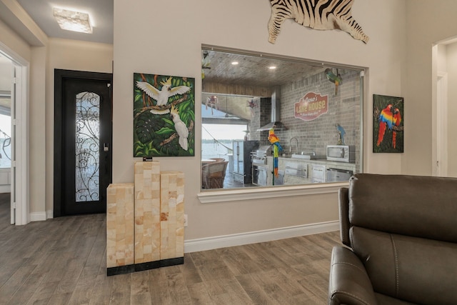 9314 Brunel Ln, Houston, TX 77044 - entrance foyer featuring wood finished floors and baseboards