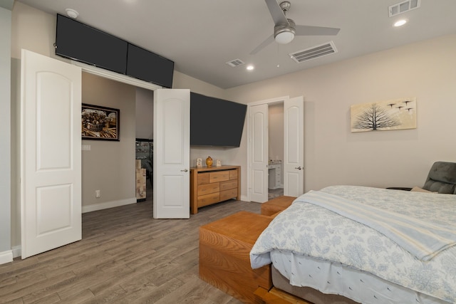 9314 Brunel Ln, Houston, TX 77044 - bedroom featuring light wood-style flooring, recessed lighting, and a ceiling fan