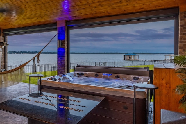 9314 Brunel Ln, Houston, TX 77044 - view of patio with a water view and a hot tub