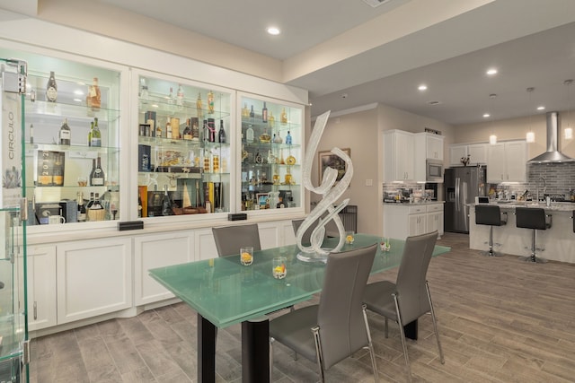 9314 Brunel Ln, Houston, TX 77044 - dining room featuring light wood-style floors and recessed lighting