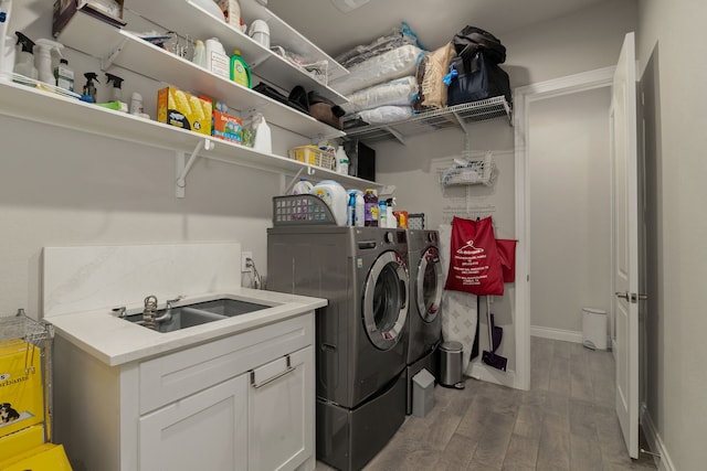 9314 Brunel Ln, Houston, TX 77044 - washroom with washing machine and dryer and wood finished floors