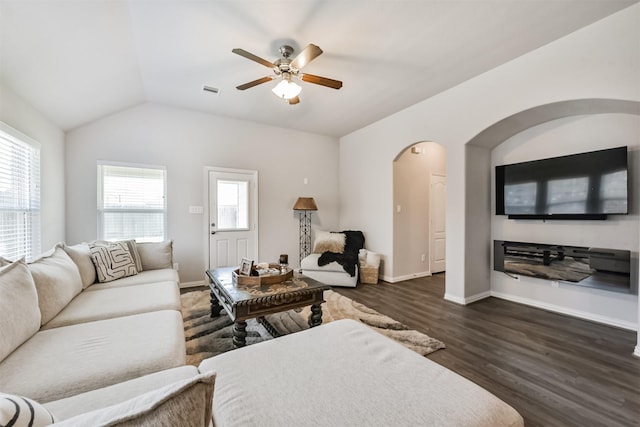 5307 Cascade Ct, Alvin, TX 77511 - living room featuring ceiling fan, arched walkways, dark wood finished floors, baseboards, and lofted ceiling
