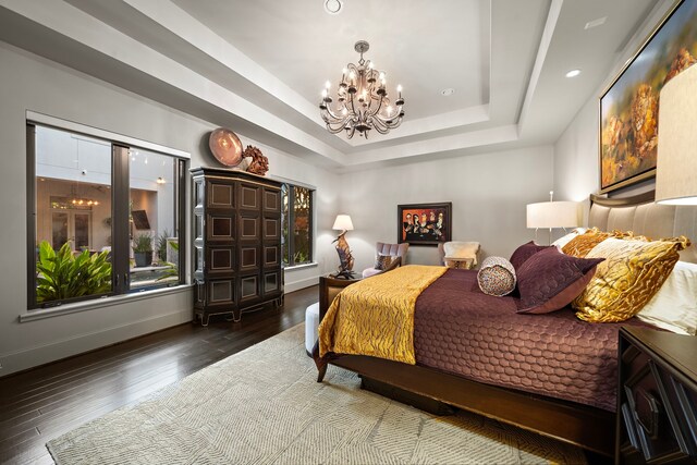 507 Terrace Dr, Houston, TX 77007 - bedroom featuring a chandelier, a tray ceiling, hardwood / wood-style floors, recessed lighting, and baseboards