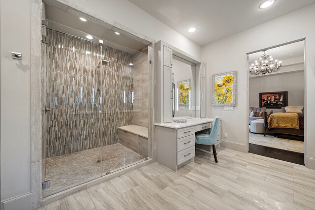 507 Terrace Dr, Houston, TX 77007 - full bath with a shower stall, ensuite bathroom, recessed lighting, baseboards, and a chandelier