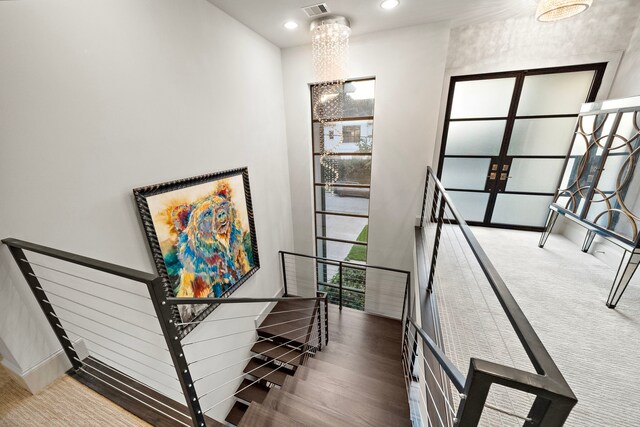 507 Terrace Dr, Houston, TX 77007 - staircase featuring recessed lighting, a chandelier, and baseboards