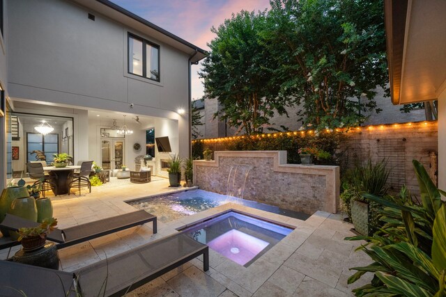 507 Terrace Dr, Houston, TX 77007 - pool at dusk featuring an in-ground hot tub and a patio area