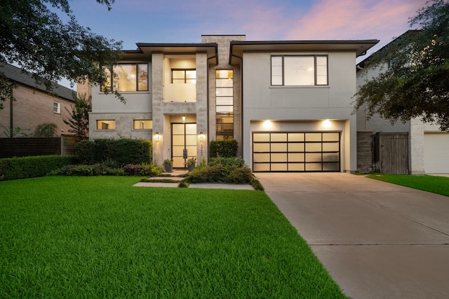 507 Terrace Dr, Houston, TX 77007 - contemporary house with concrete driveway, an attached garage, and stucco siding