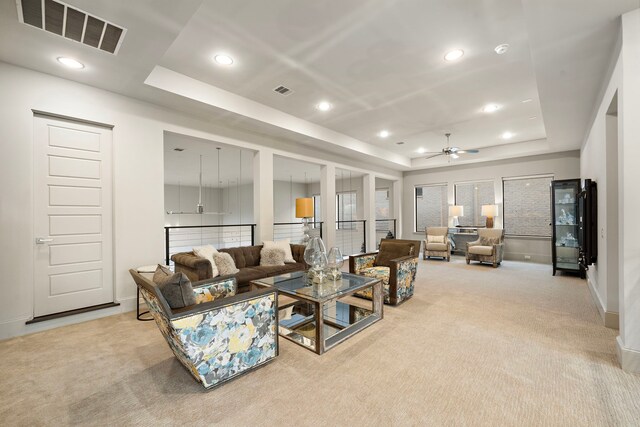 507 Terrace Dr, Houston, TX 77007 - carpeted living area featuring a tray ceiling, a ceiling fan, baseboards, and recessed lighting