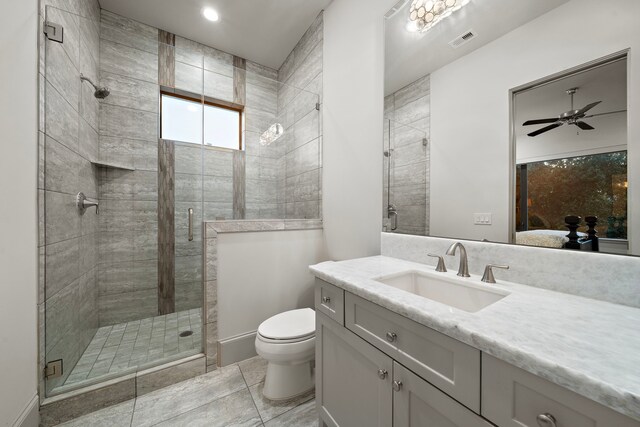 507 Terrace Dr, Houston, TX 77007 - full bathroom featuring toilet, vanity, a shower stall, a ceiling fan, and ensuite bath