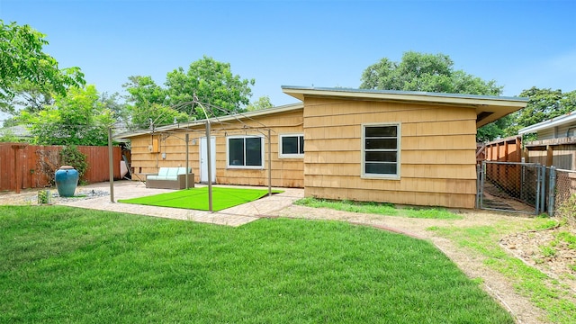 6805 Mobud Dr, Houston, TX 77074 - back of property featuring an outdoor hangout area and a patio