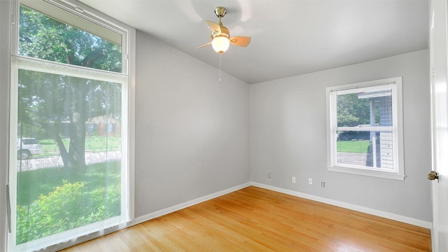 6805 Mobud Dr, Houston, TX 77074 - spare room with healthy amount of natural light, light wood finished floors, and a ceiling fan