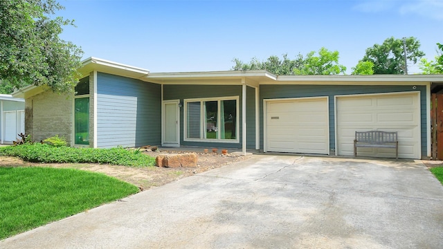 6805 Mobud Dr, Houston, TX 77074 - mid-century home with an attached garage and driveway