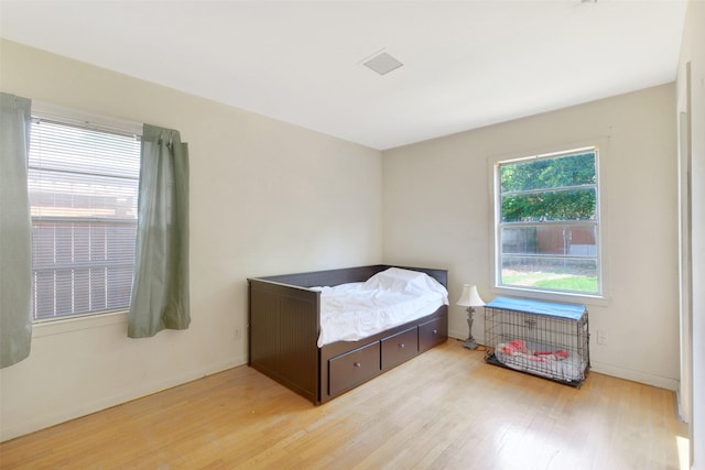 6805 Mobud Dr, Houston, TX 77074 - bedroom with light wood finished floors and baseboards