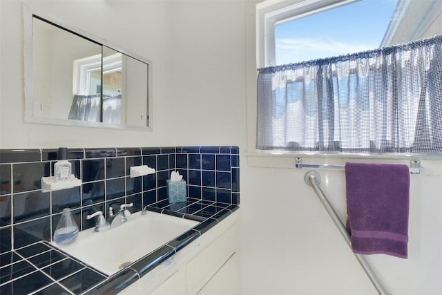 6805 Mobud Dr, Houston, TX 77074 - bathroom with vanity and tasteful backsplash