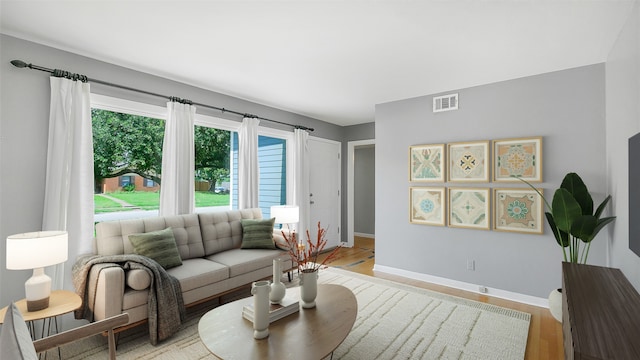 6805 Mobud Dr, Houston, TX 77074 - living area featuring baseboards and light wood-style flooring