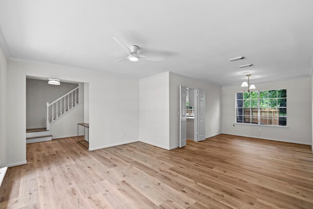 150 Rushwing Pl, The Woodlands, TX 77381 - unfurnished room featuring crown molding, light wood-style flooring, a ceiling fan, stairway, and baseboards