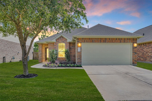 24734 Colonial Maple Dr, Katy, TX 77493 - view of front of house with concrete driveway, brick siding, an attached garage, a yard, and roof with shingles
