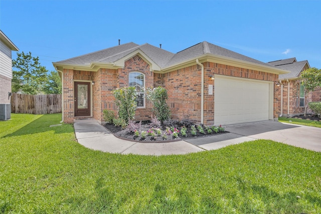24734 Colonial Maple Dr, Katy, TX 77493 - view of front of home with driveway, a garage, a shingled roof, central AC, and brick siding