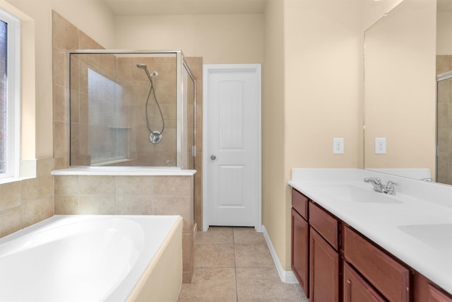 24734 Colonial Maple Dr, Katy, TX 77493 - full bathroom featuring a garden tub, tile patterned flooring, double vanity, and a tile shower
