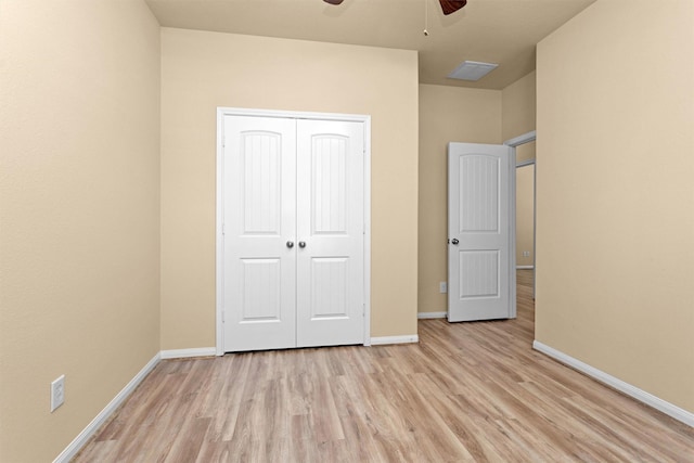 24734 Colonial Maple Dr, Katy, TX 77493 - unfurnished bedroom with light wood-style floors, baseboards, a closet, and a ceiling fan