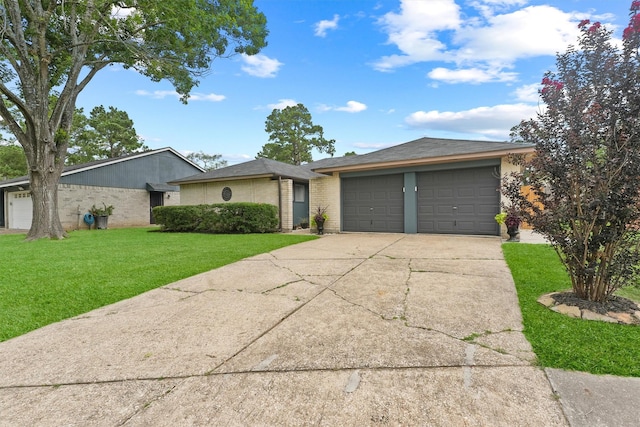 22410 Millgate Dr, Spring, TX 77373 - view of front of property featuring a front lawn, concrete driveway, and brick siding