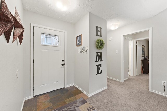 22410 Millgate Dr, Spring, TX 77373 - entryway with baseboards and a textured ceiling