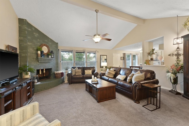 22410 Millgate Dr, Spring, TX 77373 - living room featuring carpet, ceiling fan, beamed ceiling, a fireplace, and high vaulted ceiling
