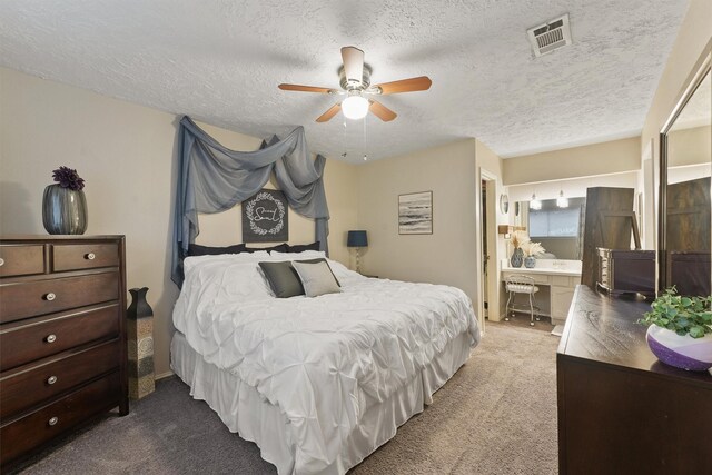 22410 Millgate Dr, Spring, TX 77373 - bedroom with carpet, a textured ceiling, ensuite bathroom, and a ceiling fan