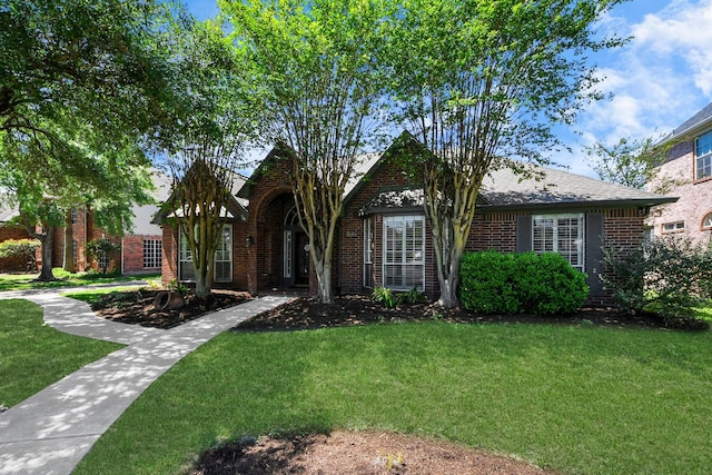 9510 Willowbridge Park Blvd, Houston, TX 77064 - tudor home with a front yard and brick siding