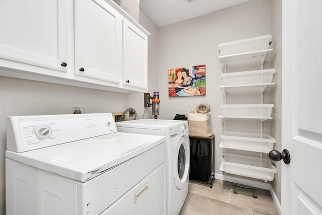 9510 Willowbridge Park Blvd, Houston, TX 77064 - laundry area with washer and dryer, cabinet space, light tile patterned floors, and baseboards