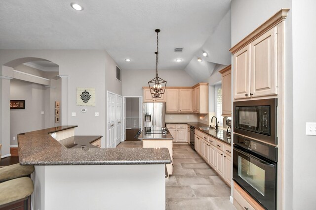 9510 Willowbridge Park Blvd, Houston, TX 77064 - kitchen with black appliances, a spacious island, a sink, arched walkways, and light brown cabinetry