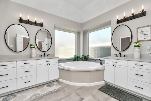 9510 Willowbridge Park Blvd, Houston, TX 77064 - full bath with two vanities, a bath, and tile patterned flooring