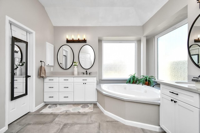 9510 Willowbridge Park Blvd, Houston, TX 77064 - full bathroom with two vanities, a bath, and baseboards