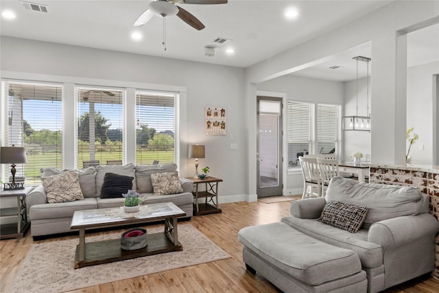 18327 Cypress Hill Dr, Rosharon, TX 77583 - living room with ceiling fan, a chandelier, wood finished floors, recessed lighting, and baseboards