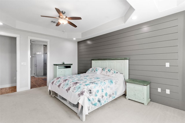18327 Cypress Hill Dr, Rosharon, TX 77583 - bedroom with light colored carpet, recessed lighting, a ceiling fan, a raised ceiling, and wood walls