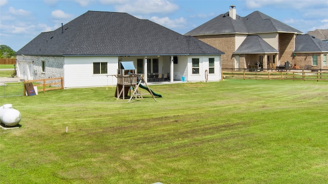 18327 Cypress Hill Dr, Rosharon, TX 77583 - rear view of house featuring a patio area, roof with shingles, and a chimney