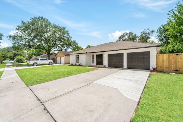 10530 Tenneco Dr, Houston, TX 77099 - ranch-style home featuring a garage, driveway, and a shingled roof