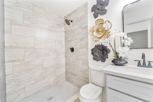 10530 Tenneco Dr, Houston, TX 77099 - bathroom with a tile shower, vanity, and toilet