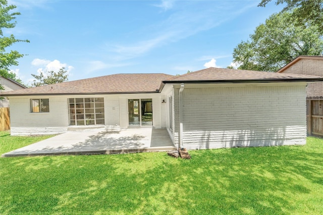 10530 Tenneco Dr, Houston, TX 77099 - rear view of house featuring brick siding, a patio area, and roof with shingles