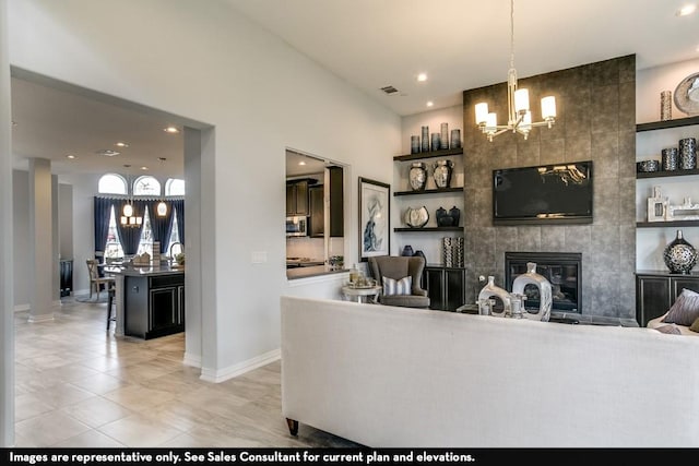 804 Wormwood Dr, League City, TX 77573 - living room featuring a chandelier, recessed lighting, a tile fireplace, baseboards, and light tile patterned floors