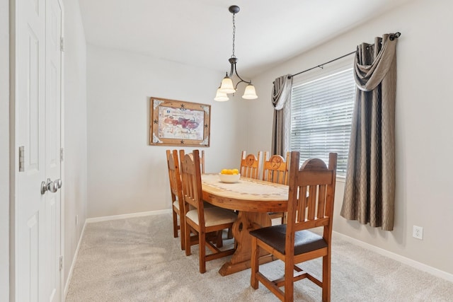 8402 Piping Rock St, Baytown, TX 77523 - dining area with light colored carpet, baseboards, and a chandelier