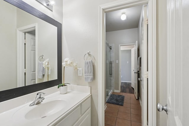 8402 Piping Rock St, Baytown, TX 77523 - bathroom featuring vanity, tile patterned flooring, and a shower stall