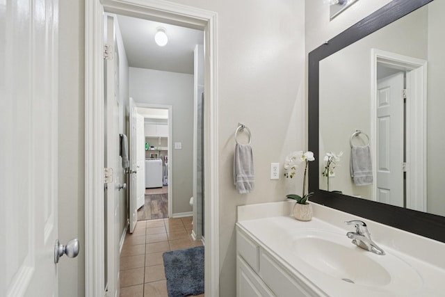 8402 Piping Rock St, Baytown, TX 77523 - bathroom with vanity, tile patterned floors, and baseboards