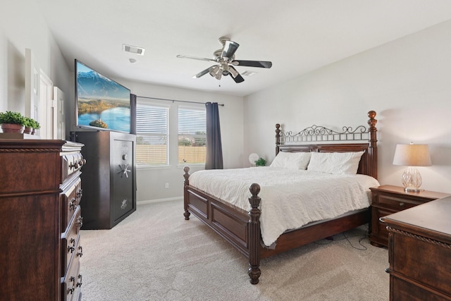 8402 Piping Rock St, Baytown, TX 77523 - bedroom featuring light colored carpet, baseboards, and a ceiling fan