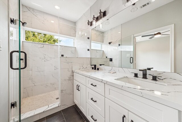 4211 Faulkner St, Houston, TX 77021 - bathroom with double vanity, a marble finish shower, tile patterned flooring, and ceiling fan