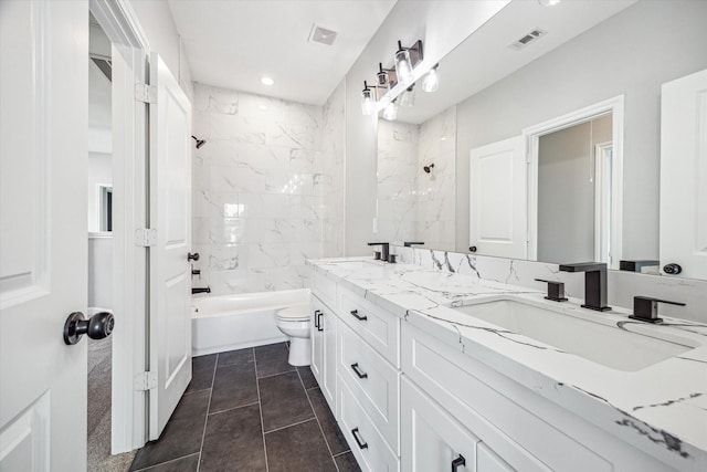 4211 Faulkner St, Houston, TX 77021 - bathroom featuring double vanity, toilet, shower / tub combination, recessed lighting, and tile patterned flooring