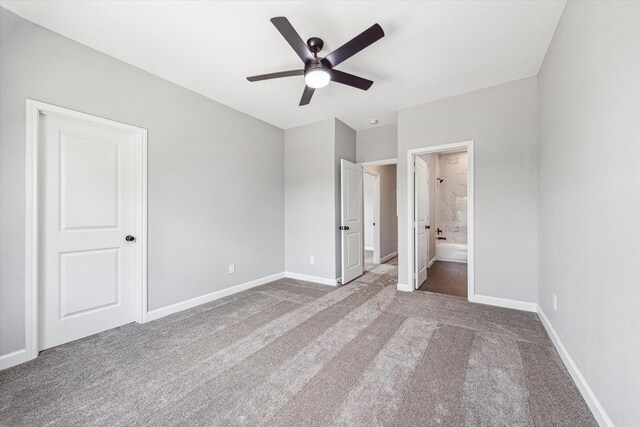 4211 Faulkner St, Houston, TX 77021 - unfurnished bedroom with carpet, baseboards, ensuite bath, and a ceiling fan