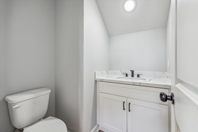 4211 Faulkner St, Houston, TX 77021 - half bathroom featuring toilet, vanity, and lofted ceiling
